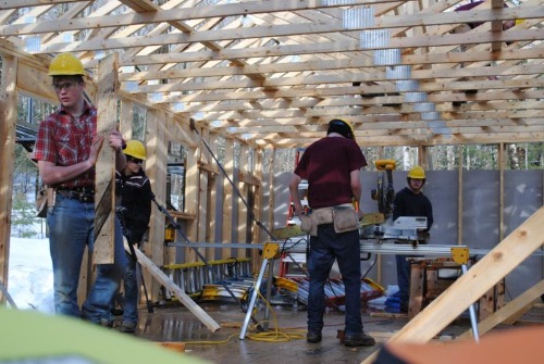 Men working on constructions for WMCA Home Replacement program